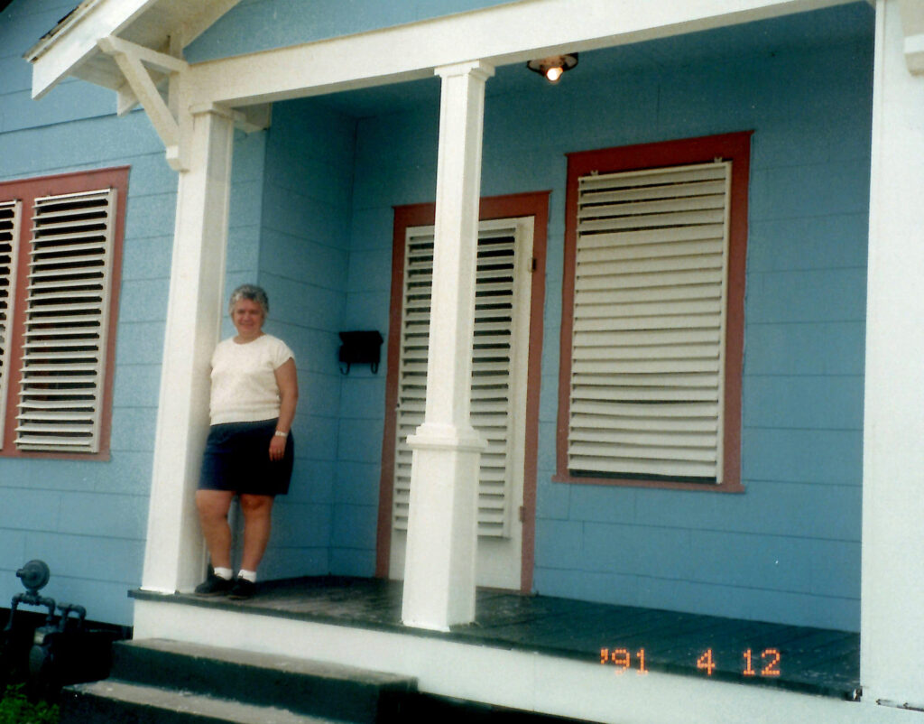 Mom Standing on the porch of my first house in Galveston. The photo was taken in 1991.